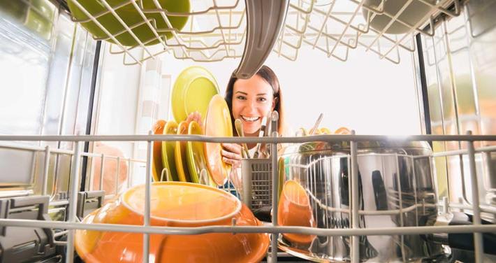 woman loading a dishwasher